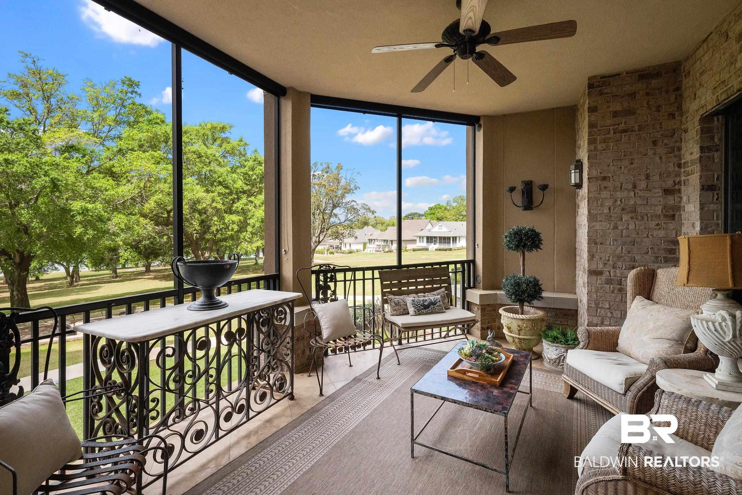 Image 2: Sunroom featuring ceiling fan and a residential view