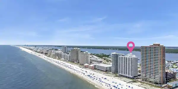 Image 3: Beachfront high-rise building with direct beach access, situated along a long stretch of sandy coastline