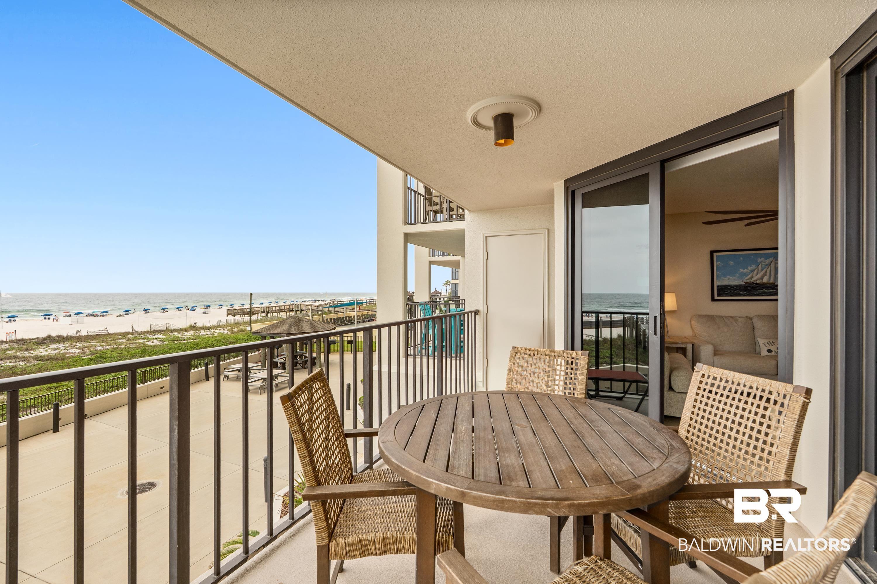 Image 3: Private balcony featuring a metal railing and tile flooring