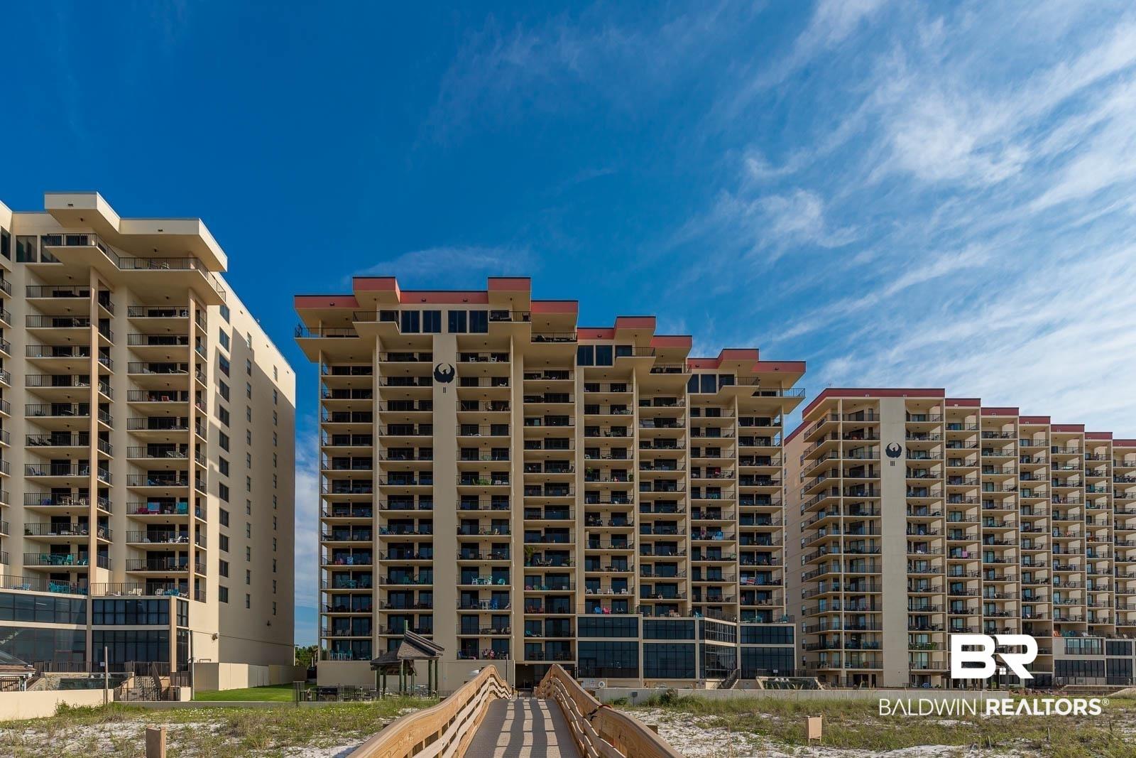 Image 1: View of apartment building / complex