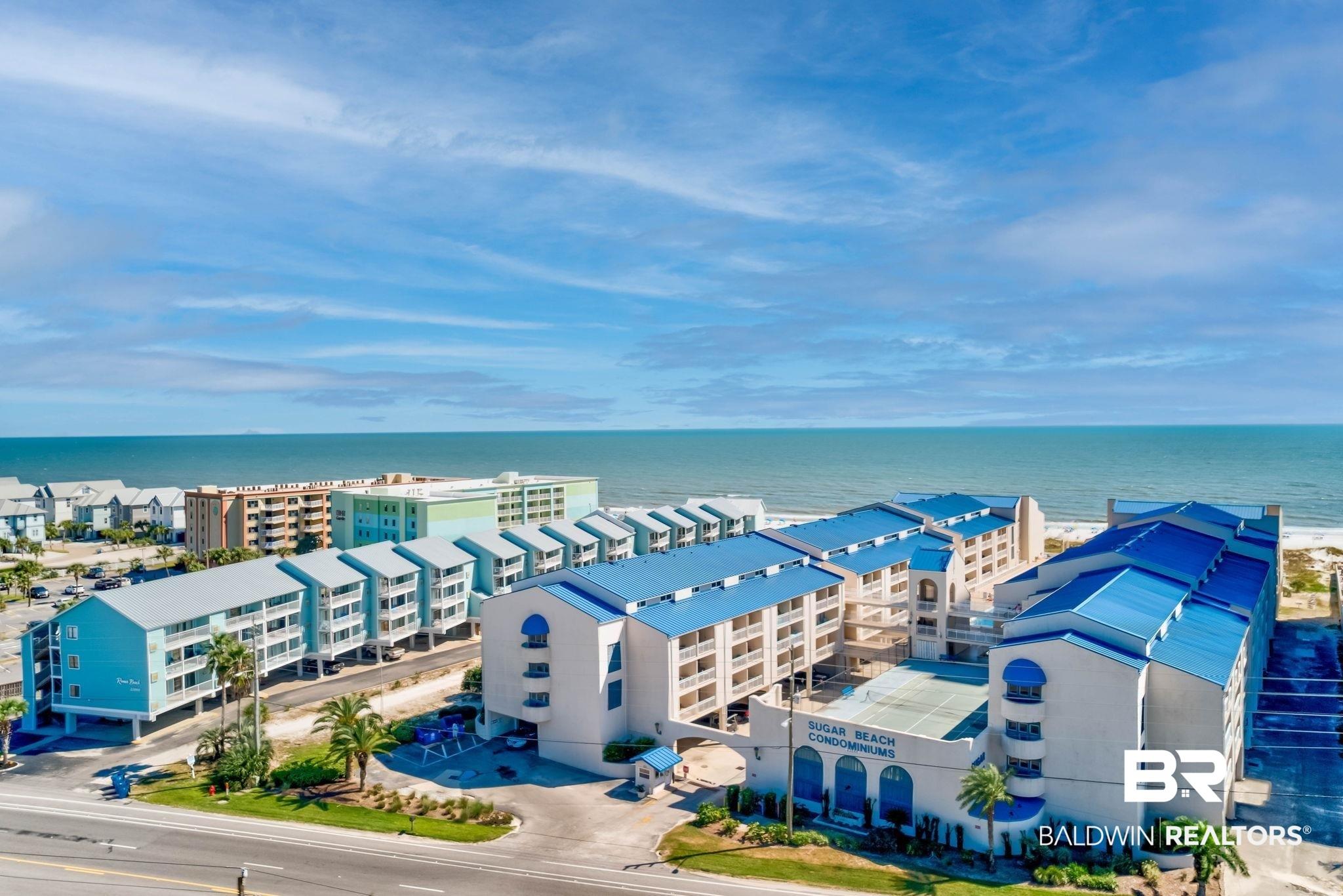 Image 2: Bird's eye view of apartment complex / building and a nearby body of water