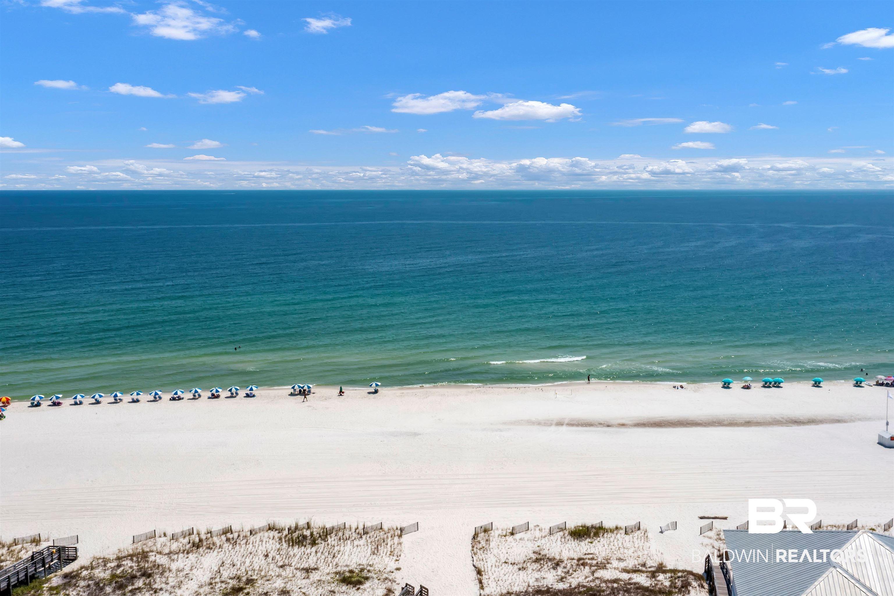 Image 2: Expansive white sand beach with turquoise water