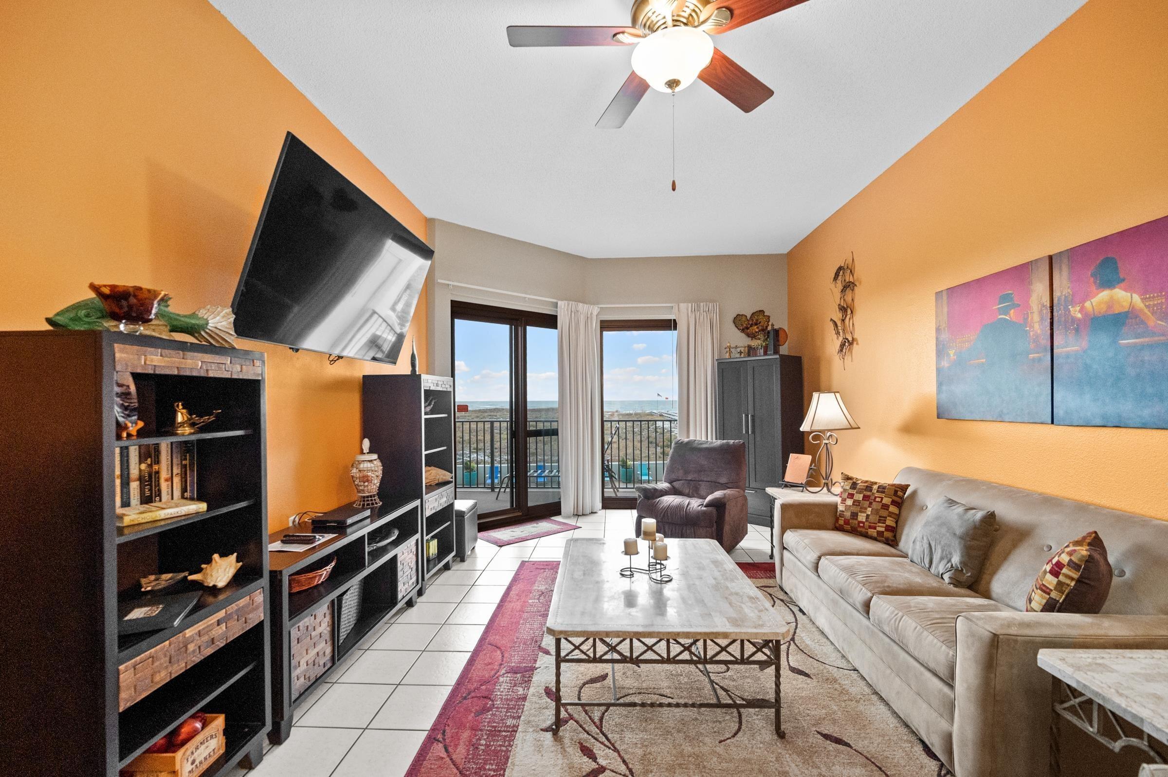 Image 4: Living room featuring ceiling fan and light tile patterned floors