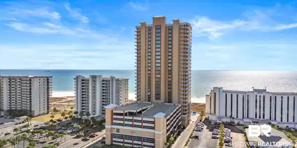 Image 2: Drone / aerial view of a nearby body of water and apartment complex
