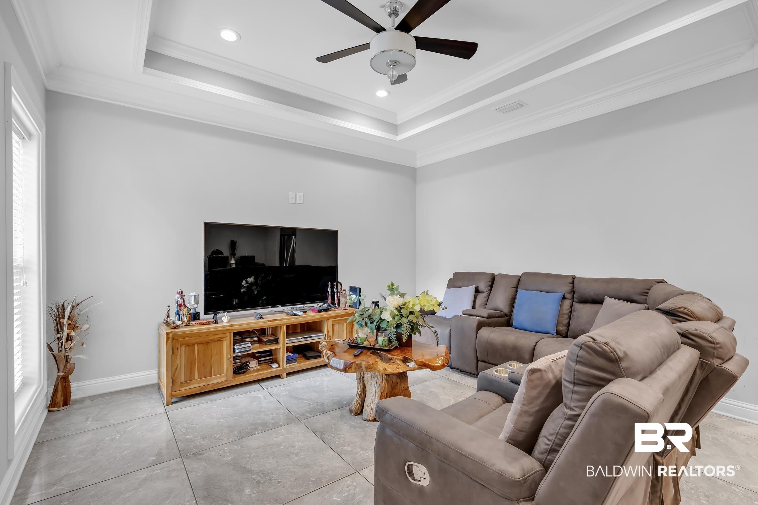 Image 3: Living room with crown molding, recessed lighting, and a ceiling fan