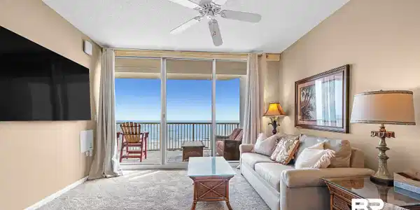 Image 3: Living room featuring baseboards, carpet, ceiling fan, floor to ceiling windows, and a textured ceiling
