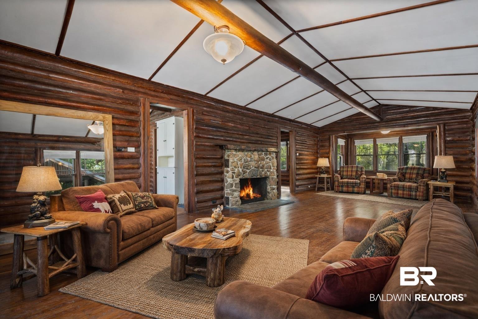 Image 2: greatroom with fireplace and alcove with bay windows