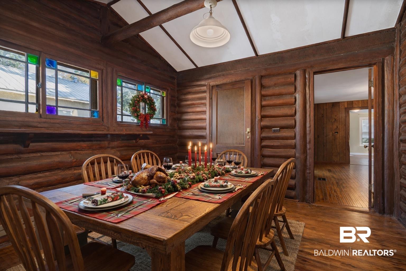 Image 3: formal dining area with original windows with stain glass inserts