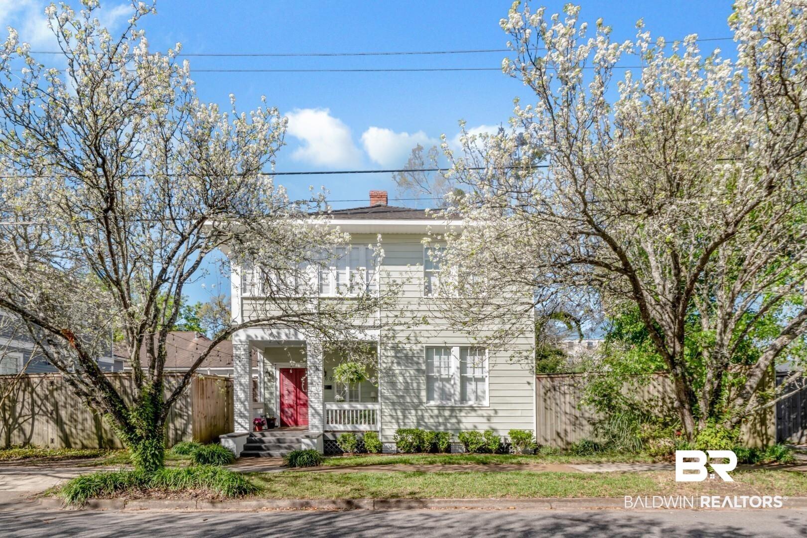 Image 3: Italianate house featuring a chimney