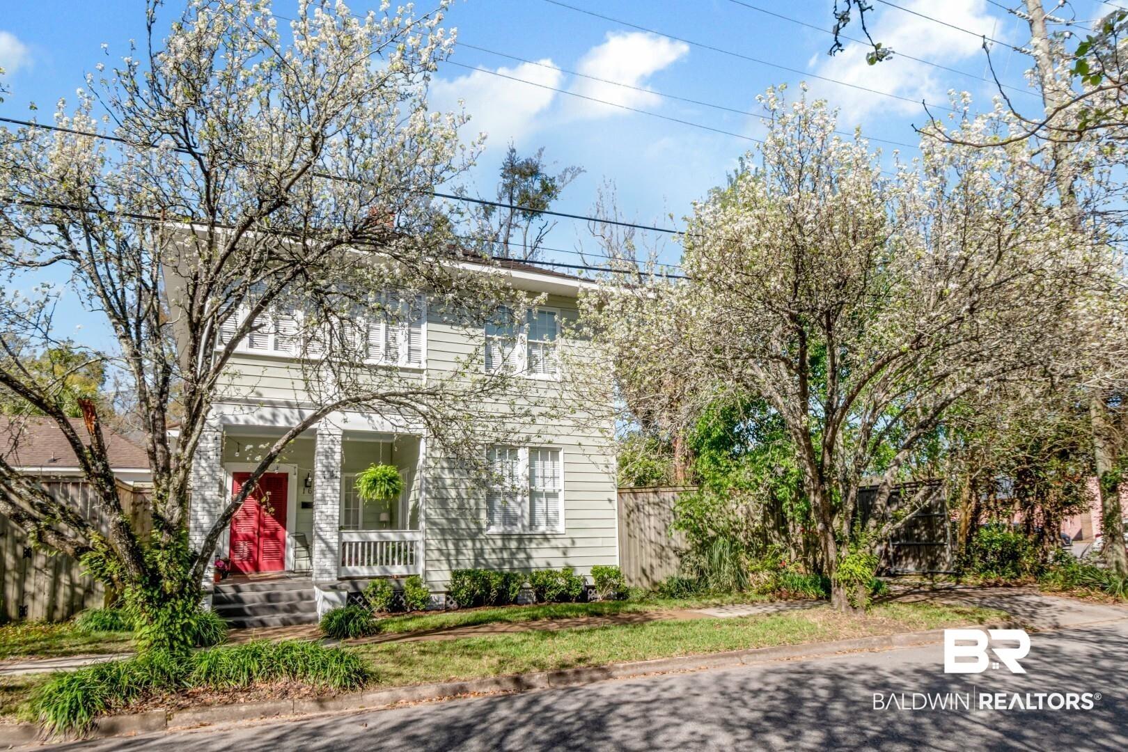 Image 4: Colonial-style house featuring a porch