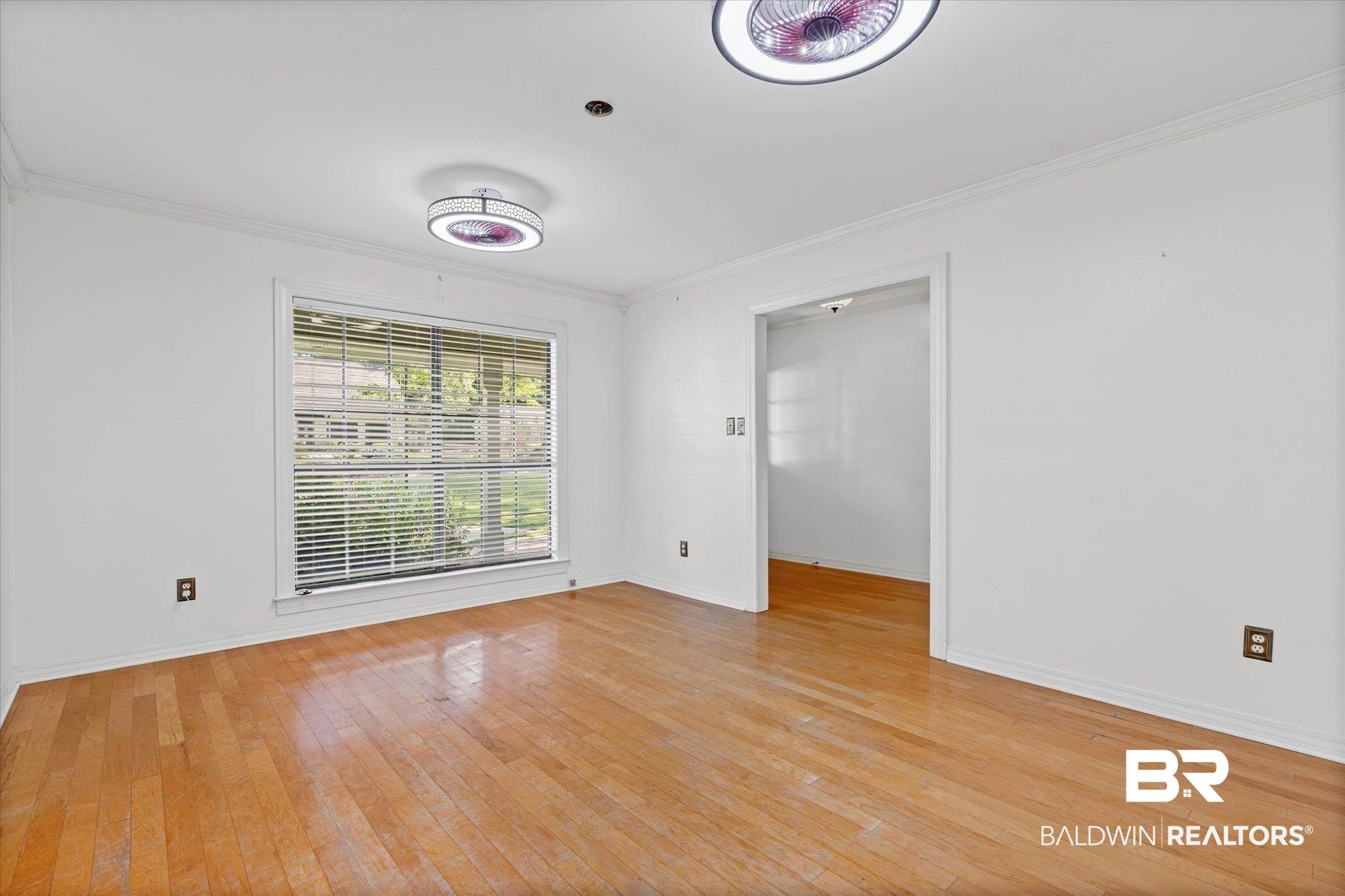 Image 2: Featuring Entry, hardwood floors, and modern ceiling fan/light fixtures
