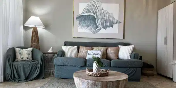 Image 4: Living area featuring tile patterned floors, a textured ceiling, and ceiling fan