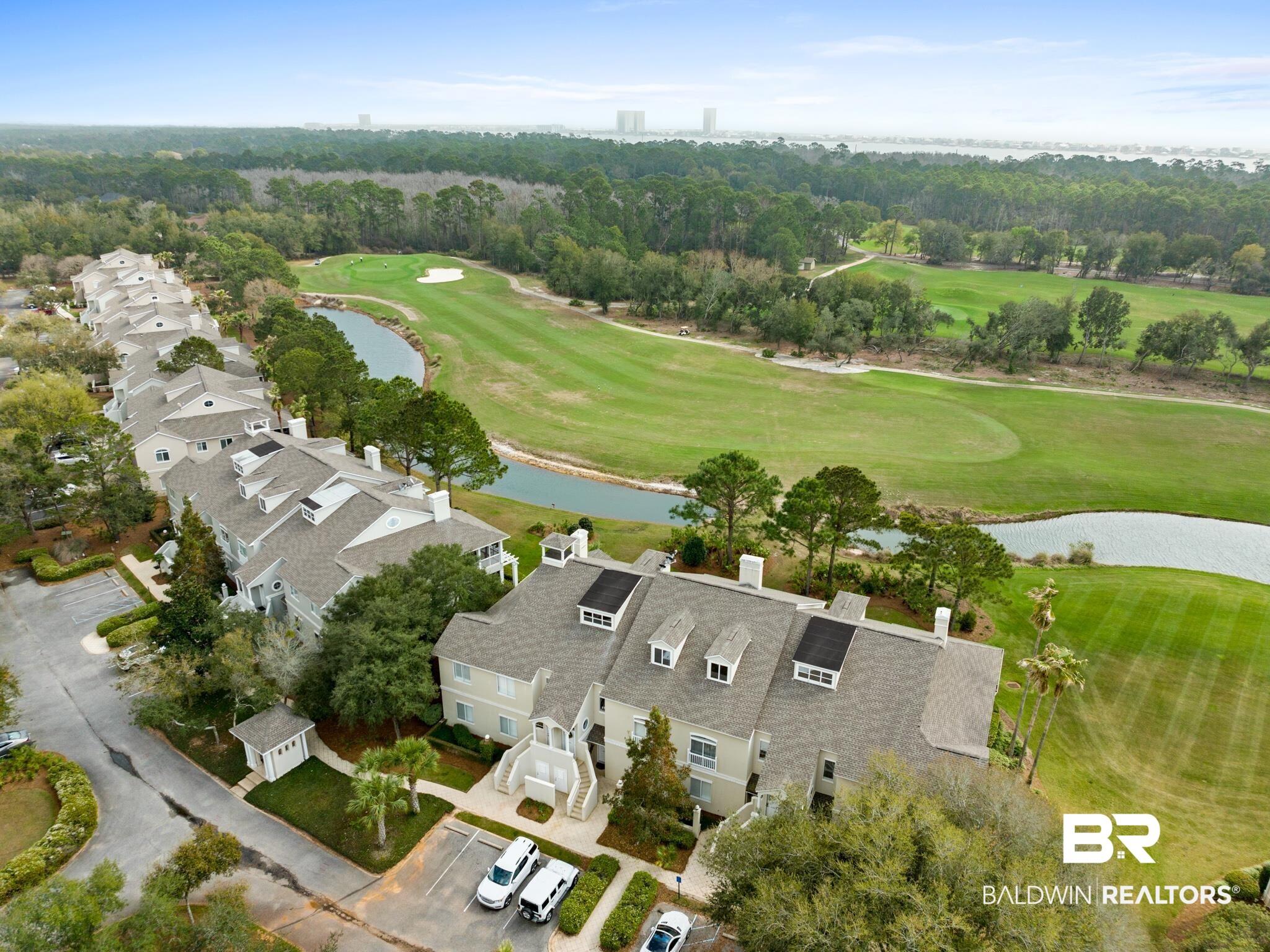Image 4: Drone / aerial view of a nearby body of water and a golf course