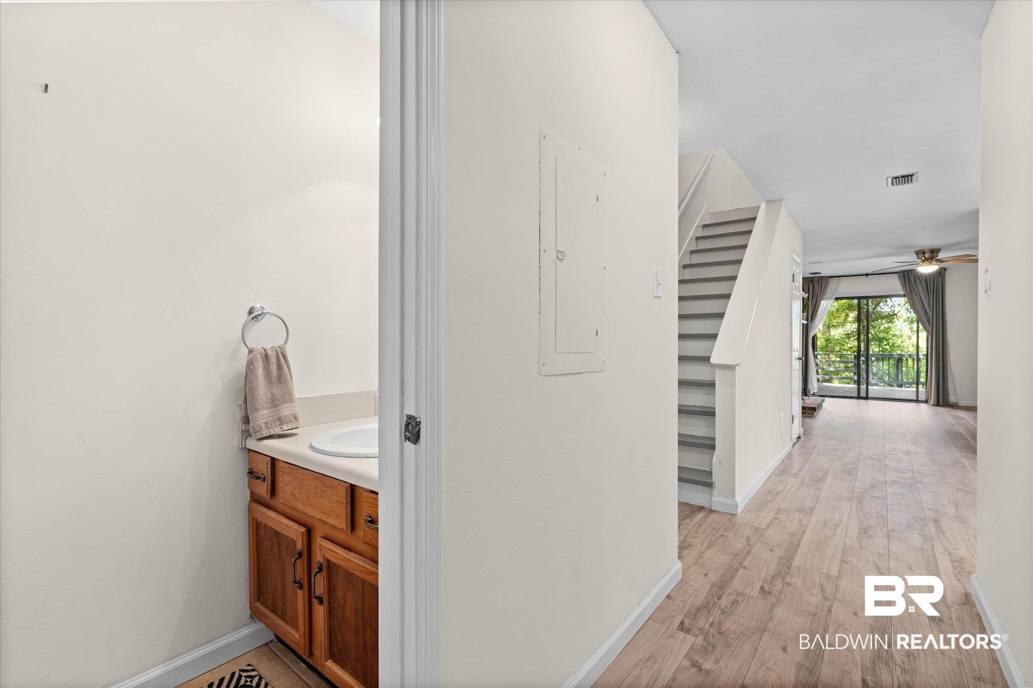 Image 4: Hall with electric panel and light wood finished floors