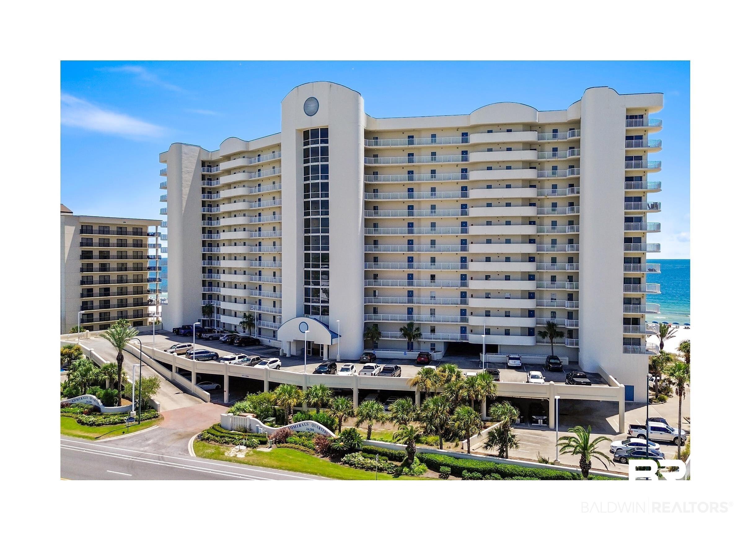 Image 1: View of apartment building / complex featuring a water view