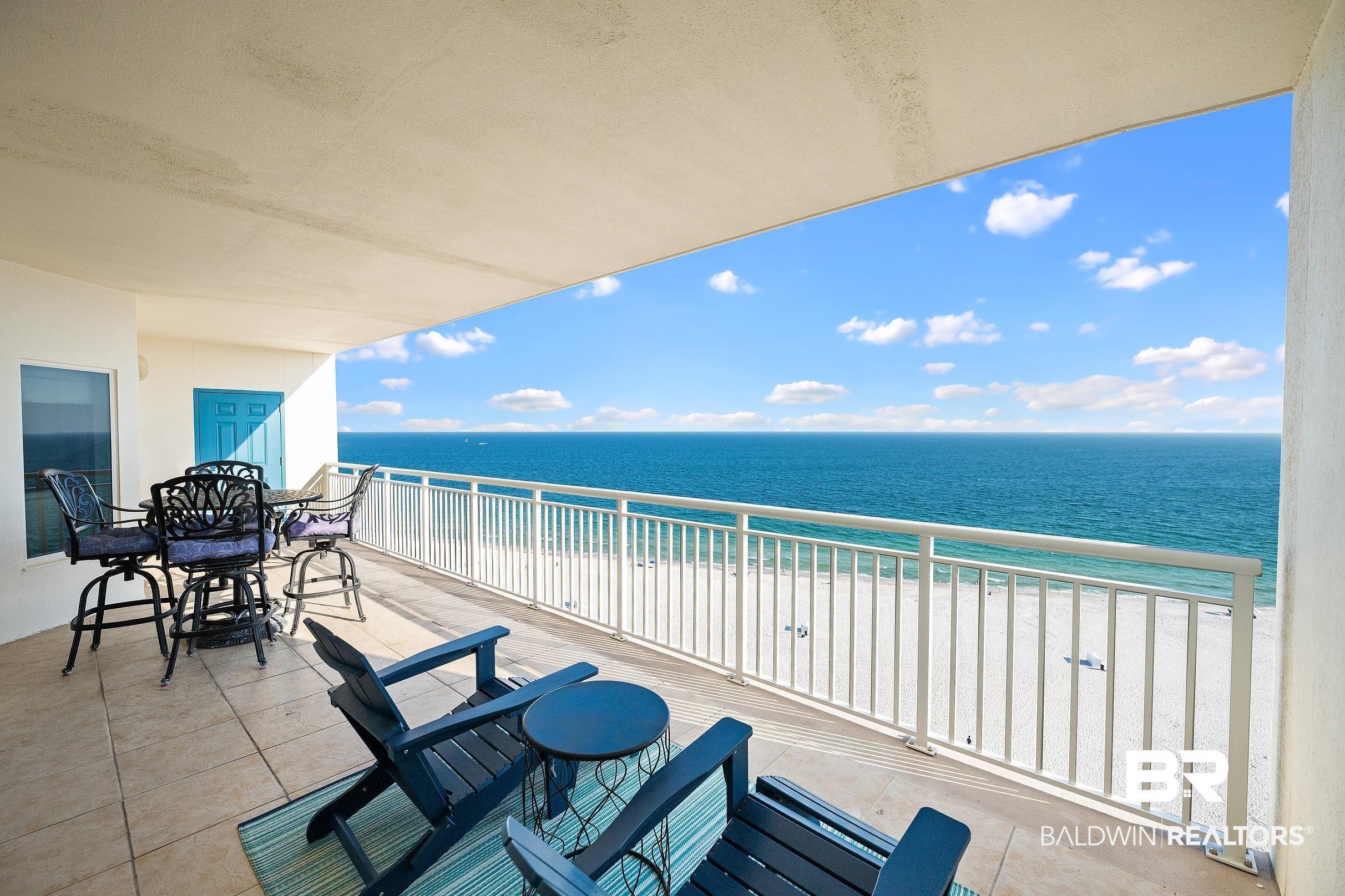 Image 2: Balcony with view of water and beach