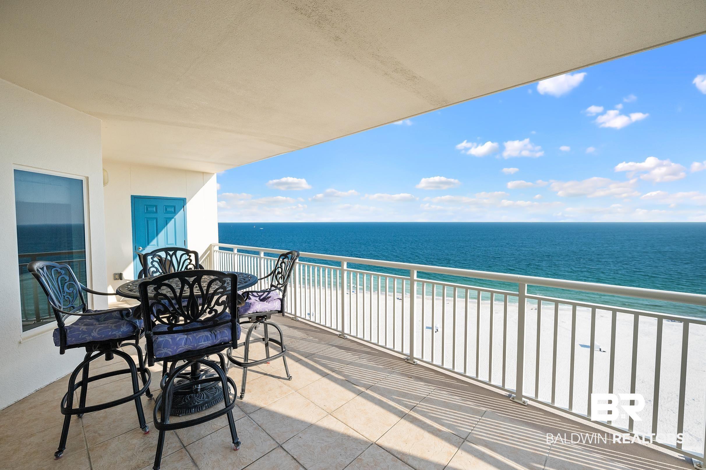Image 3: Balcony with view of water and beach