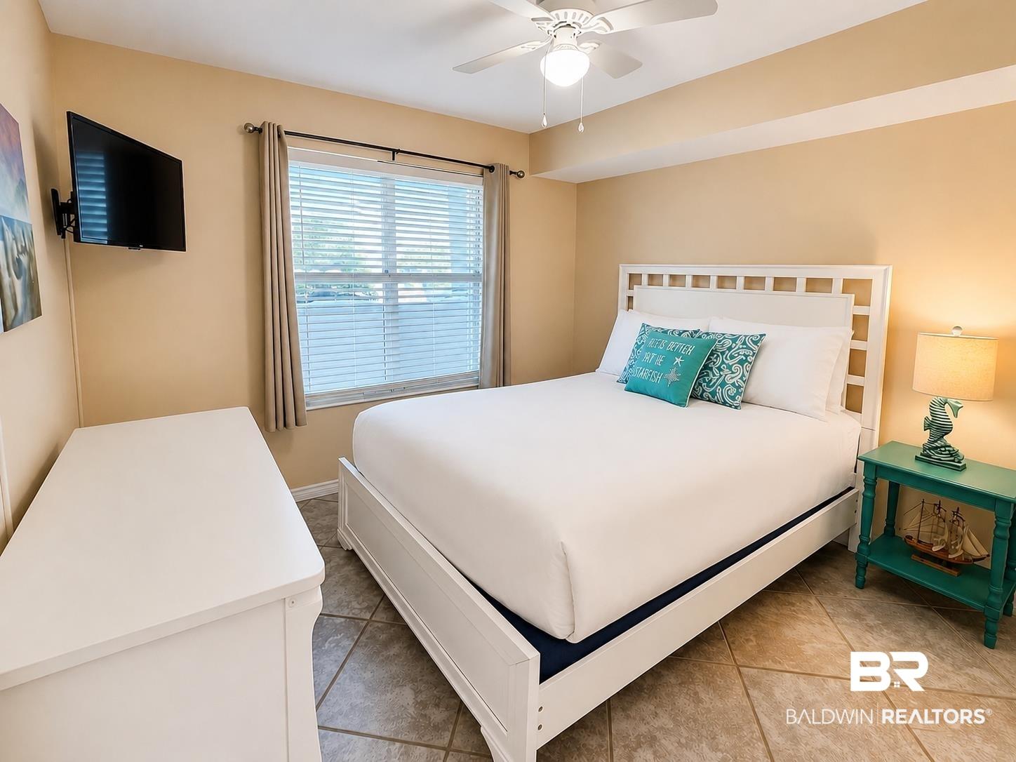 Image 2: Recessed window with blinds and drapes
