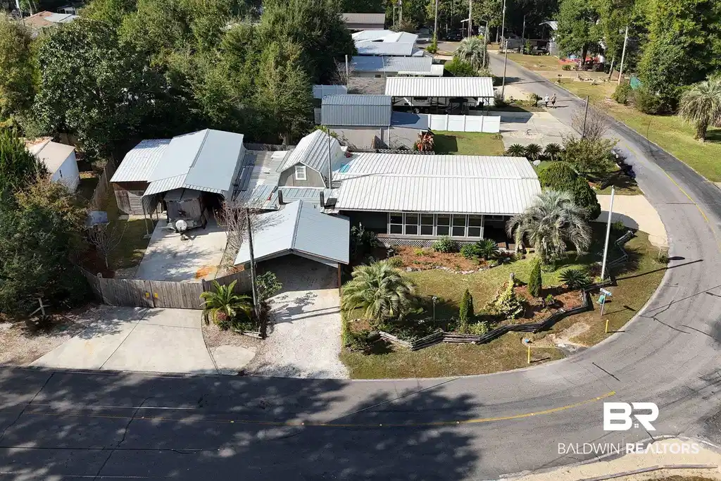 Image 1: View of subject property that sits on 3 lots on the corner