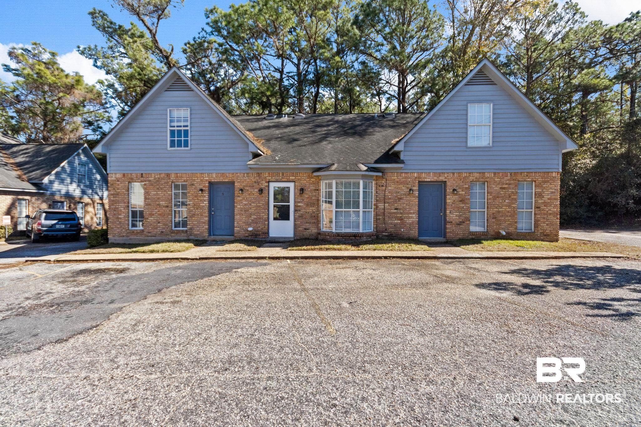 Image 2: Traditional home with brick siding