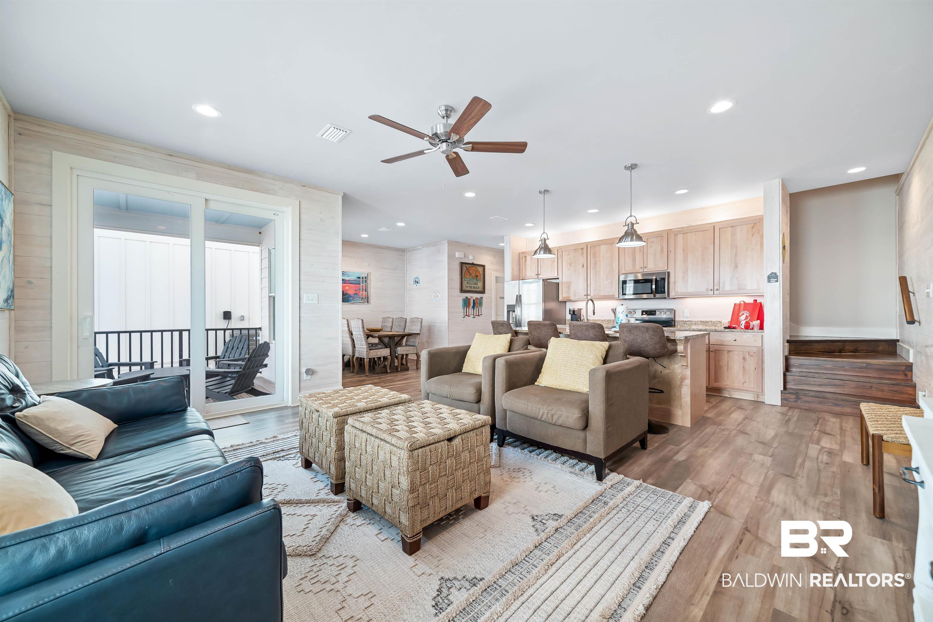 Image 2: Living room with wood finished floors, ceiling fan, and recessed lighting