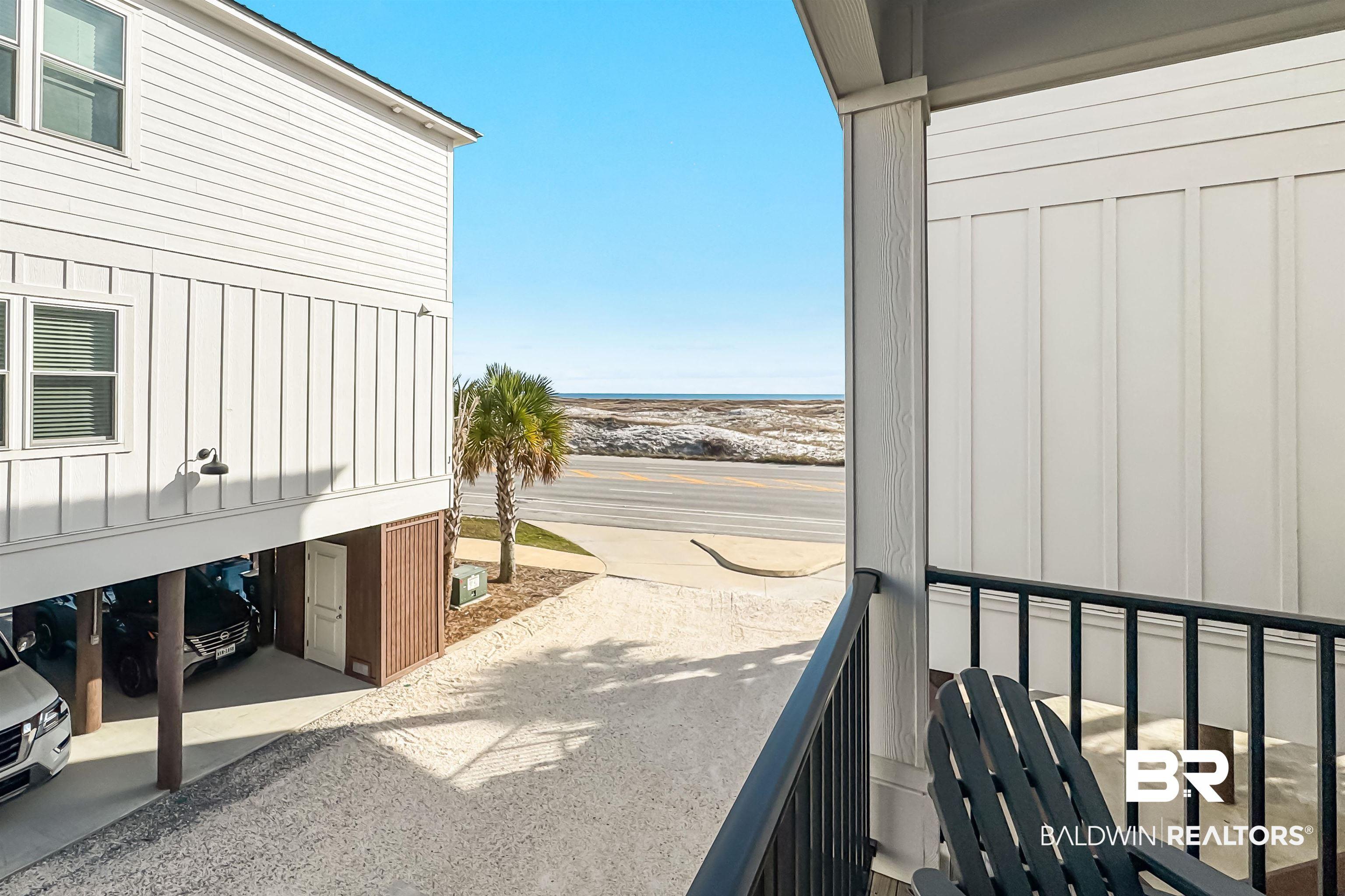 Image 4: Patio / terrace featuring a carport and a water view