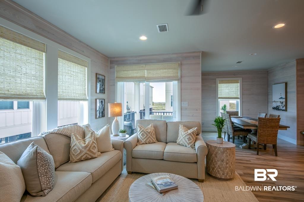 Image 3: Living room featuring wood finished floors and recessed lighting