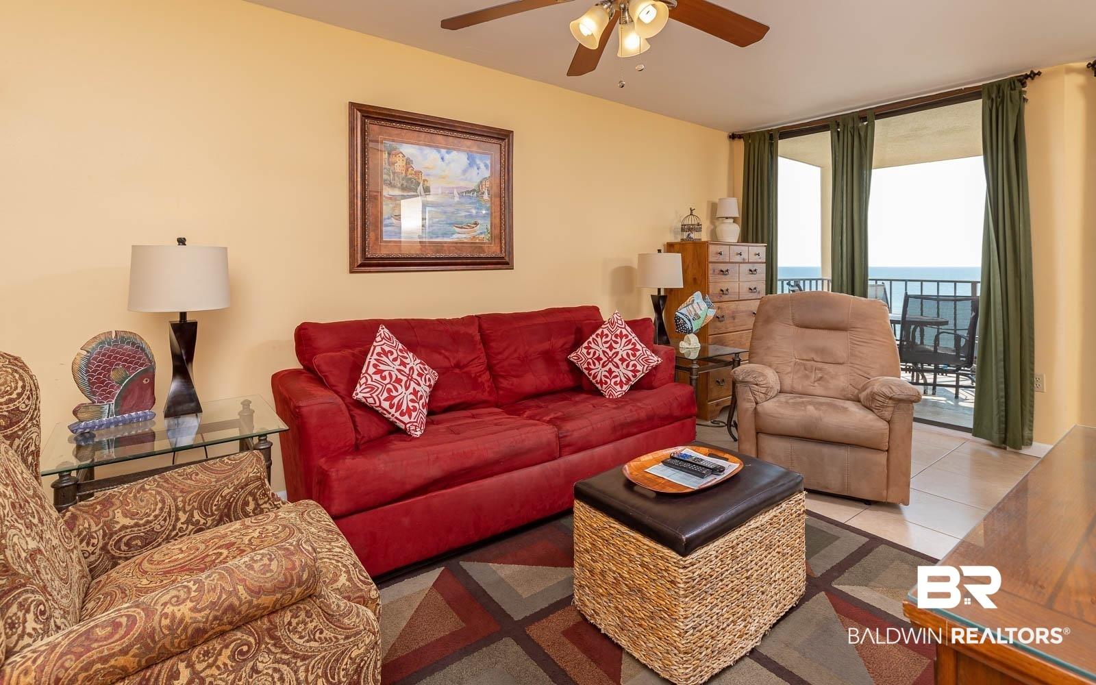 Image 3: Living area featuring light yellow walls and tile flooring