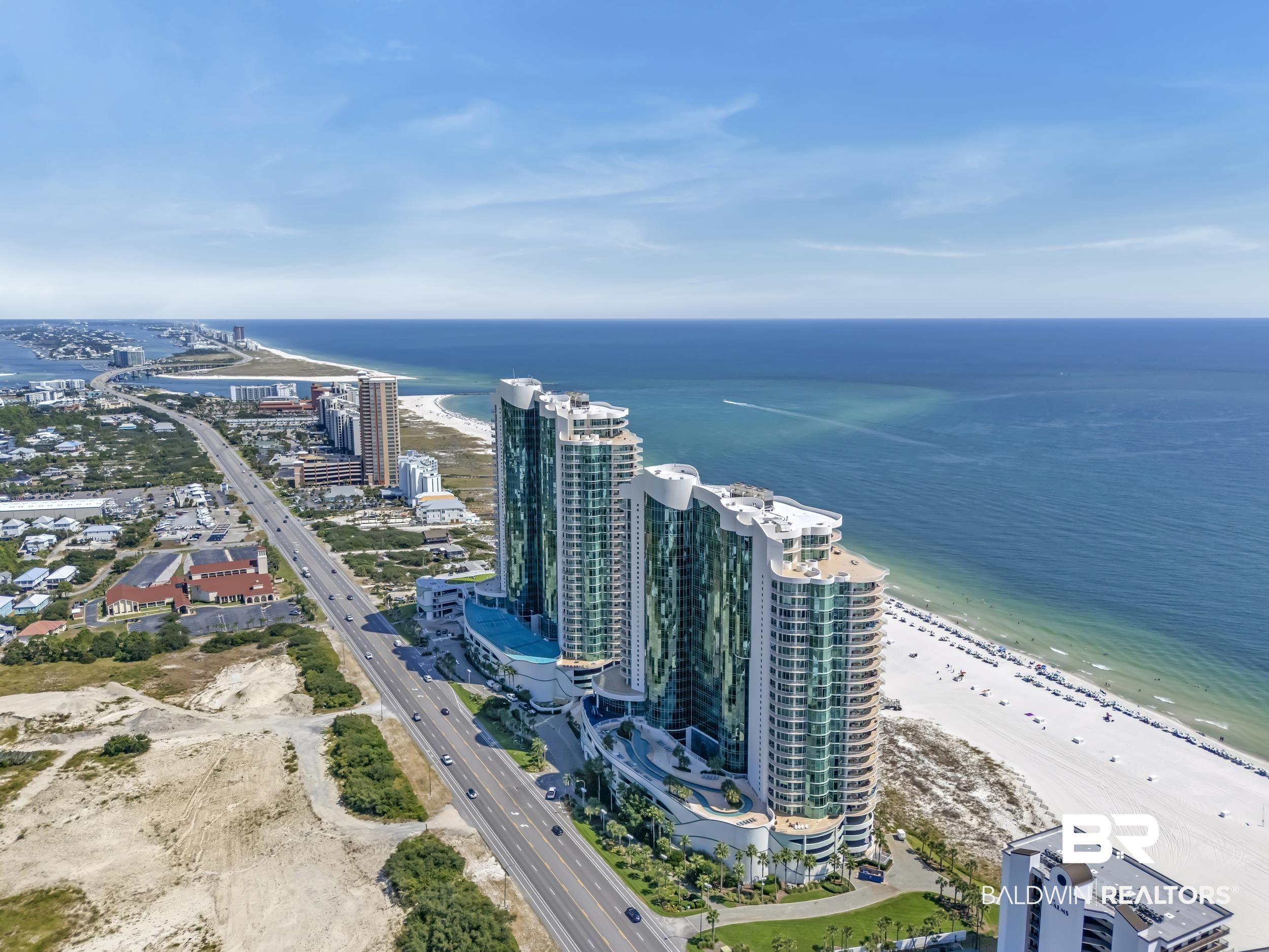 Image 2: Coastal high-rise buildings featuring extensive glass facades and multiple balconies