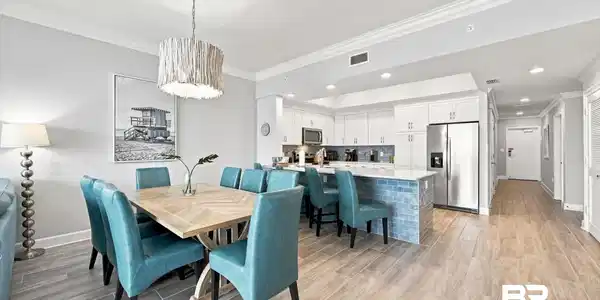 Image 4: Open-concept living space featuring wood-finish flooring, crown molding, and recessed lighting