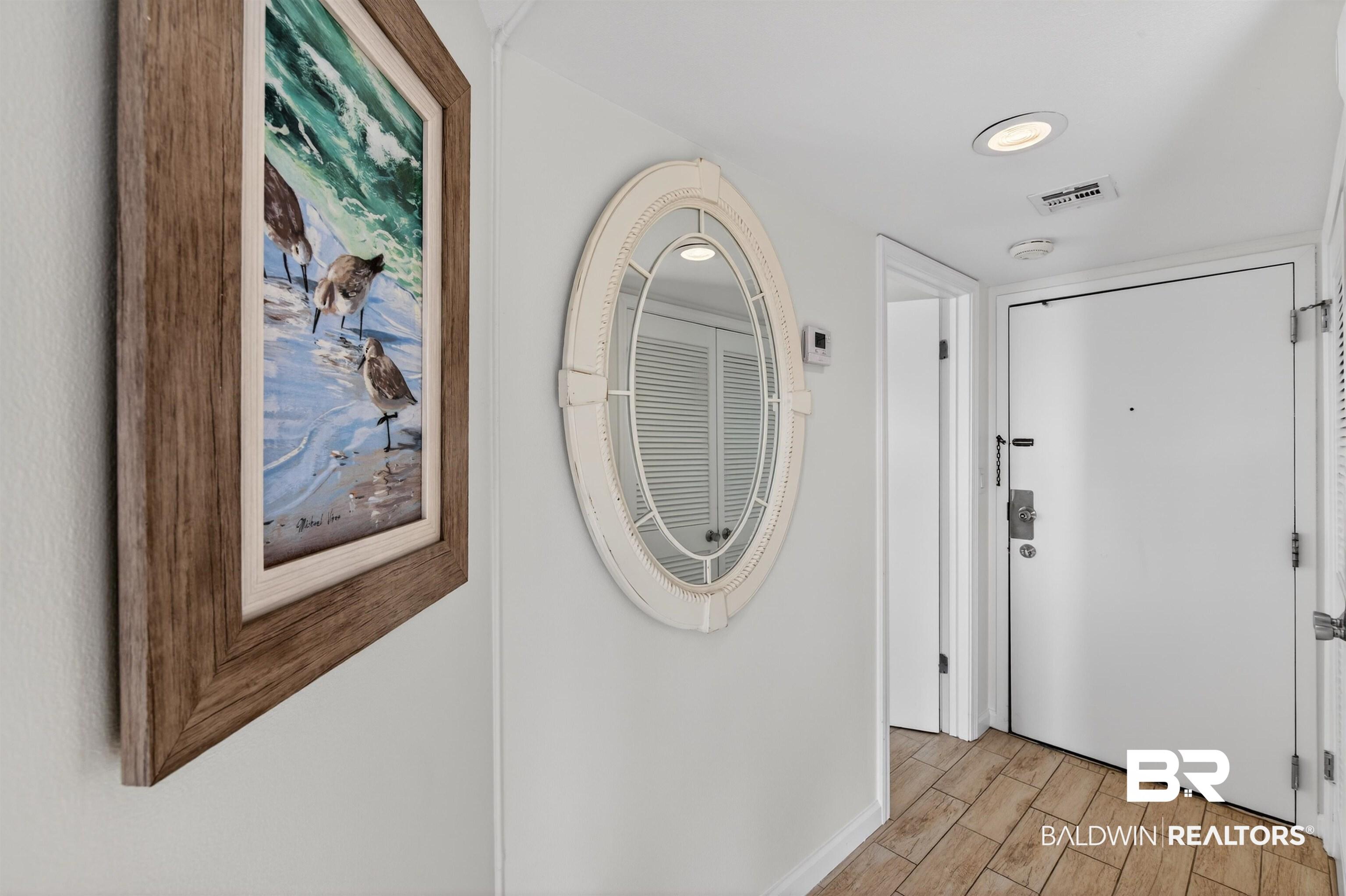 Image 2: Corridor with wood tiled floors