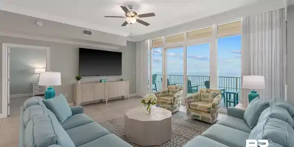 Image 4: Living room with a ceiling fan, light tile patterned floors, and crown molding
