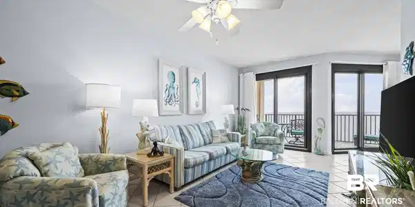 Image 3: Living room featuring a textured ceiling, light tile patterned floors, and a ceiling fan