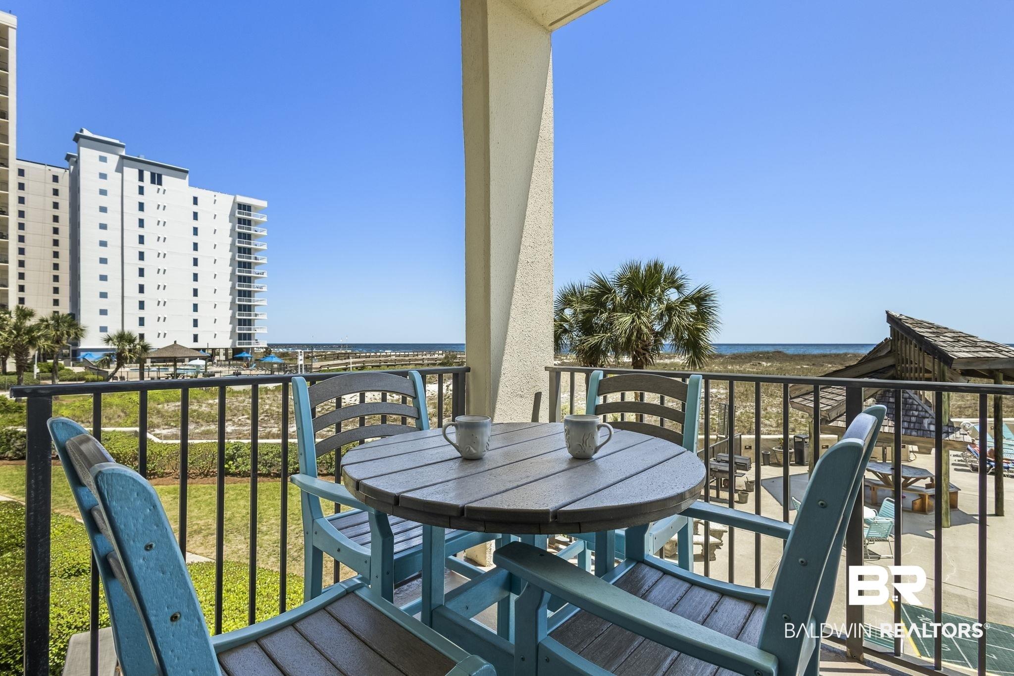 Image 4: Balcony featuring a water view