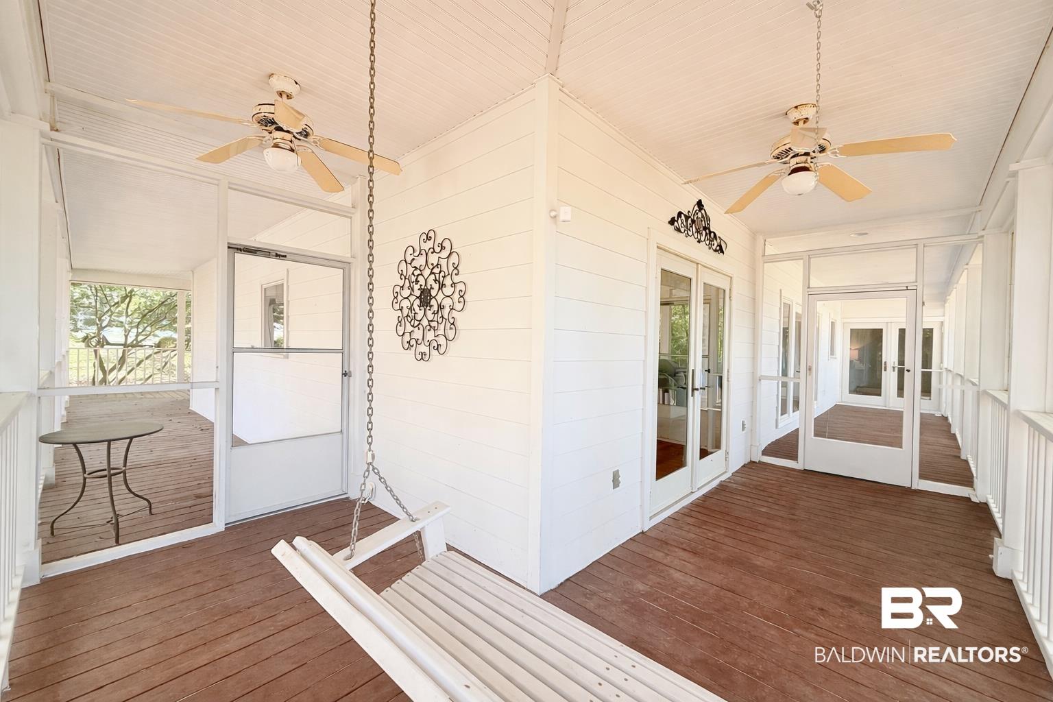 Image 2: Unfurnished sunroom with ceiling fan, french doors, and plenty of natural light