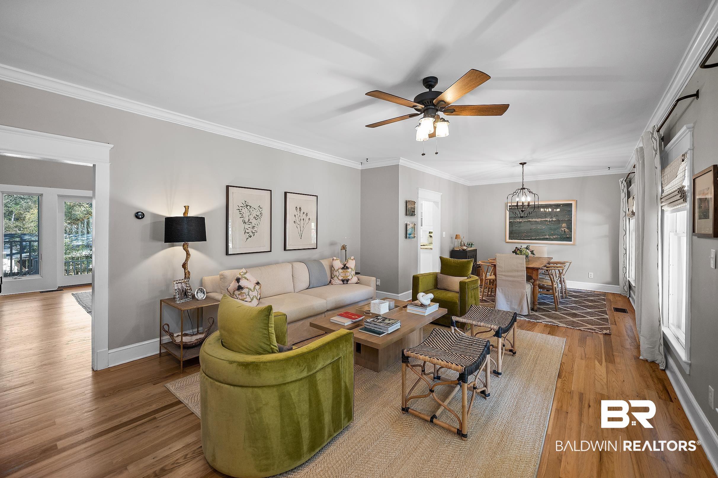 Image 3: Living area featuring crown molding, a ceiling fan, wood finished floors, and hanging lights