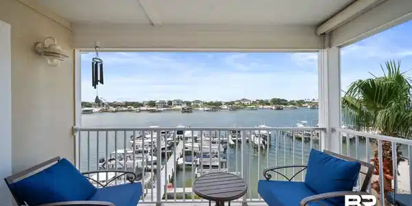 Image 3: Balcony featuring a water view