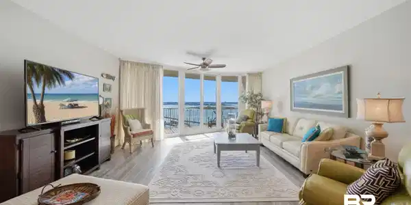 Image 2: Expansive living area with grey-toned wood-finish flooring and light wall finishes