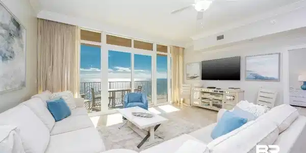 Image 4: Living area with expansive windows, ornamental molding, ceiling fan, and tile patterned flooring