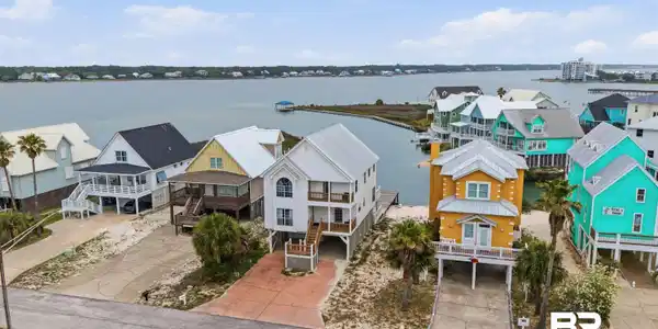 Image 4: Waterfront property featuring multiple residences with direct access to the water