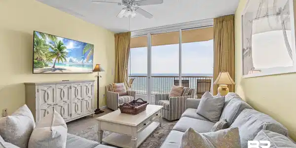 Image 3: Living area featuring a textured ceiling, a ceiling fan, and light-toned walls