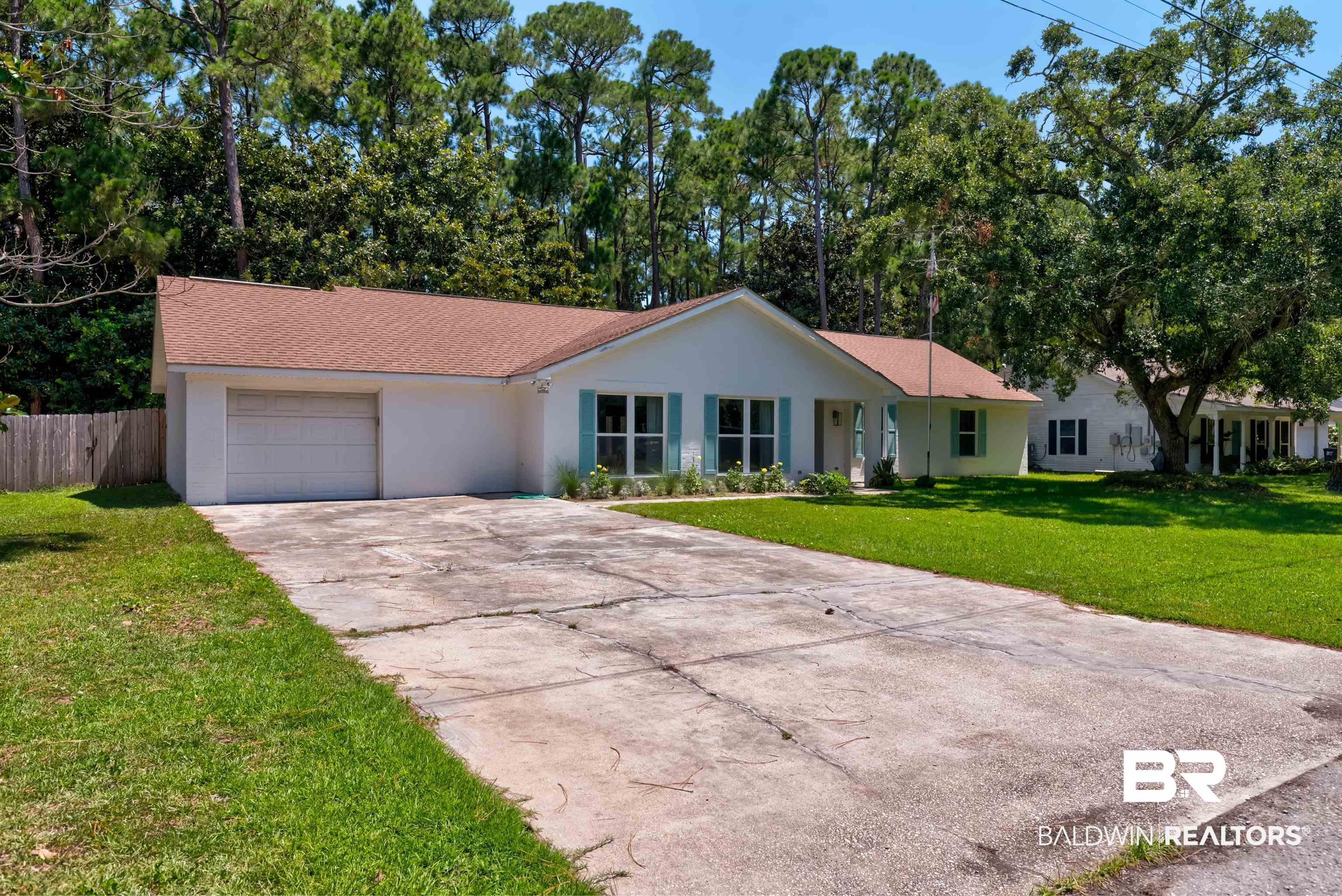 Image 2: Single story home featuring driveway, stucco siding, an attached garage, and roof with shingles