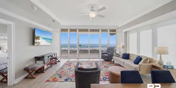 Image 2: Living area featuring floor to ceiling windows, light wood-style floors, a ceiling fan, and ornamental molding