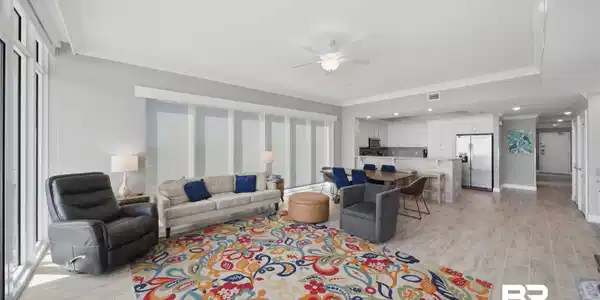 Image 4: Living area featuring ornamental molding, a ceiling fan, and wood finish floors