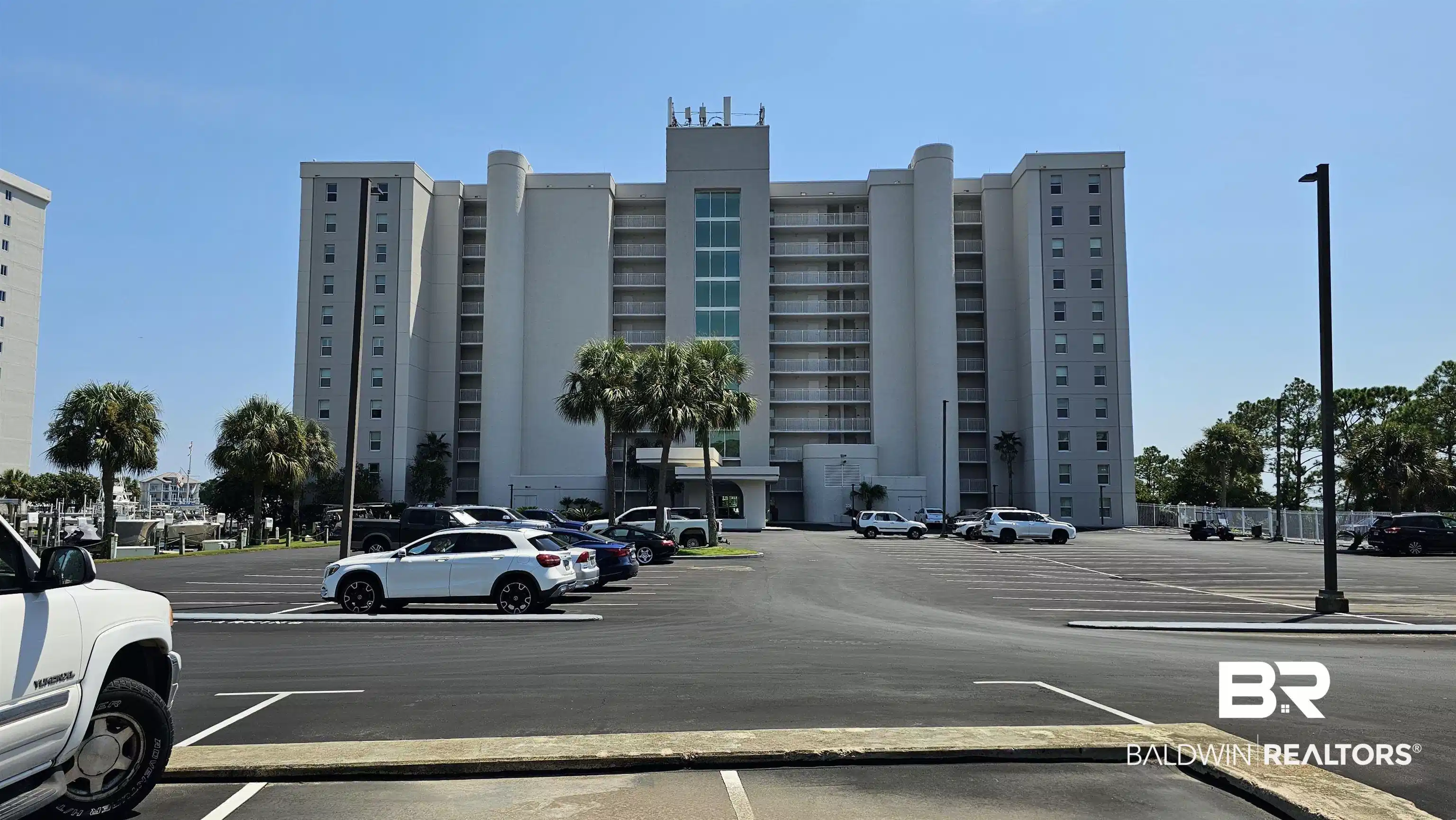 Image 1: View of apartment building / complex with uncovered parking