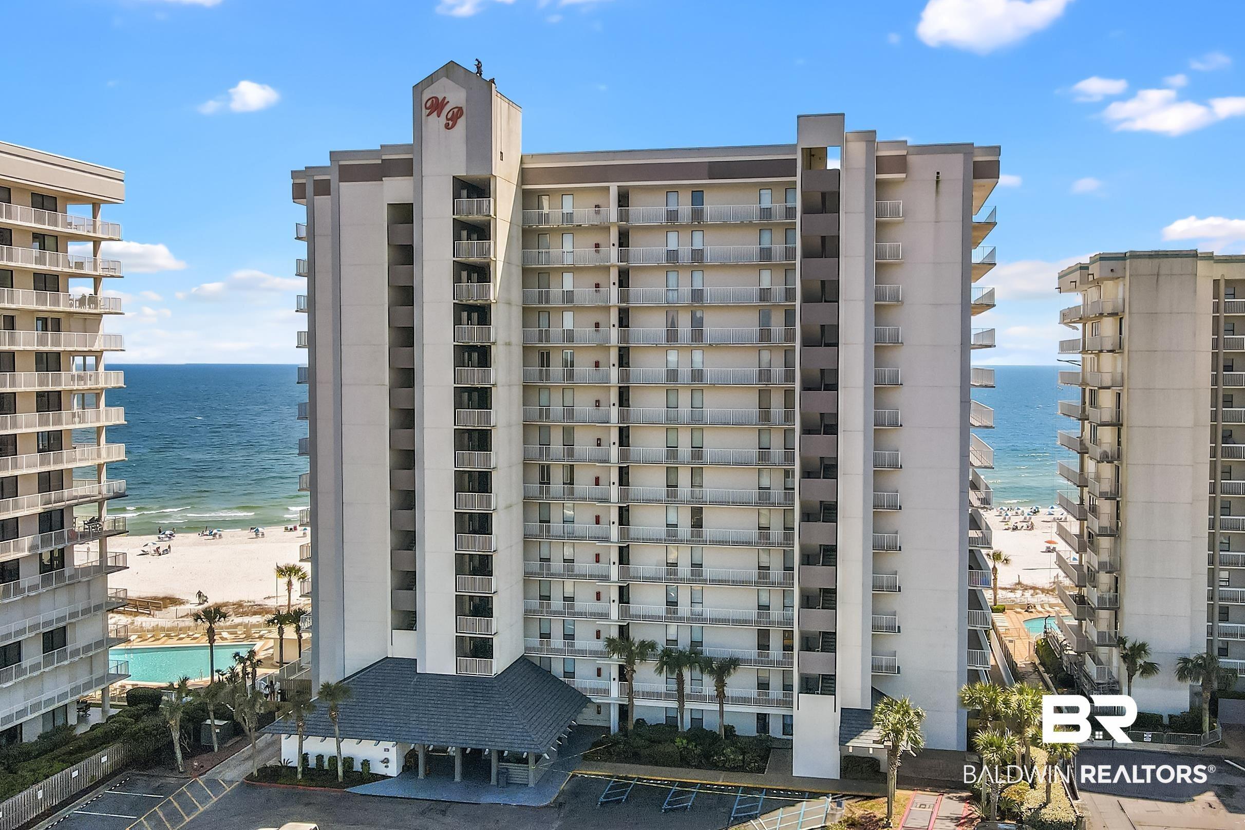 Image 3: View of apartment building / complex with a water view