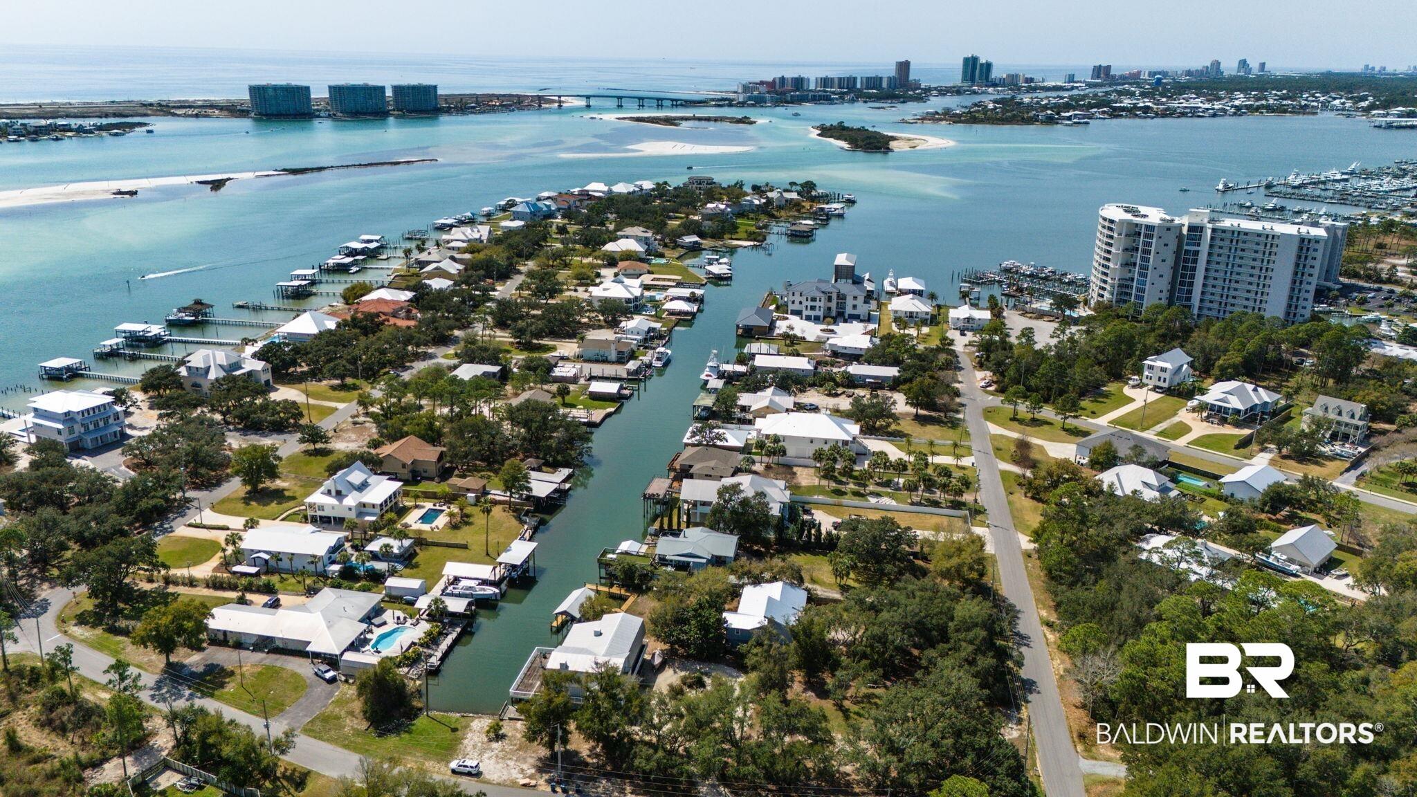 Image 2: View of urban area with a nearby body of water and nearby suburban area