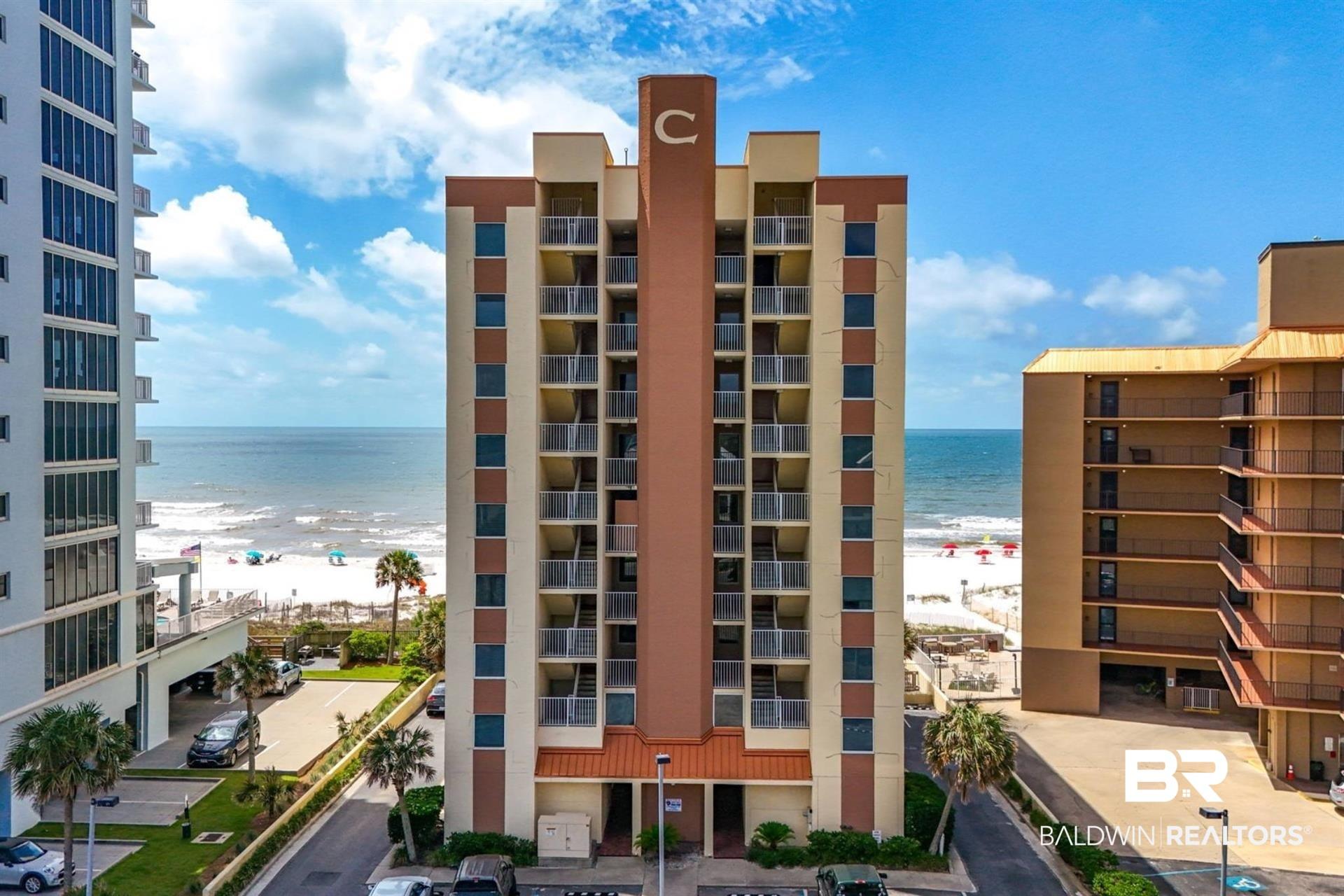 Image 2: View of apartment building / complex featuring view of water and beach