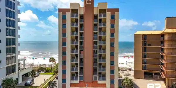 Image 2: View of apartment building / complex featuring view of water and beach