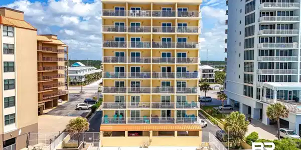Image 3: View of apartment building / complex with a community pool